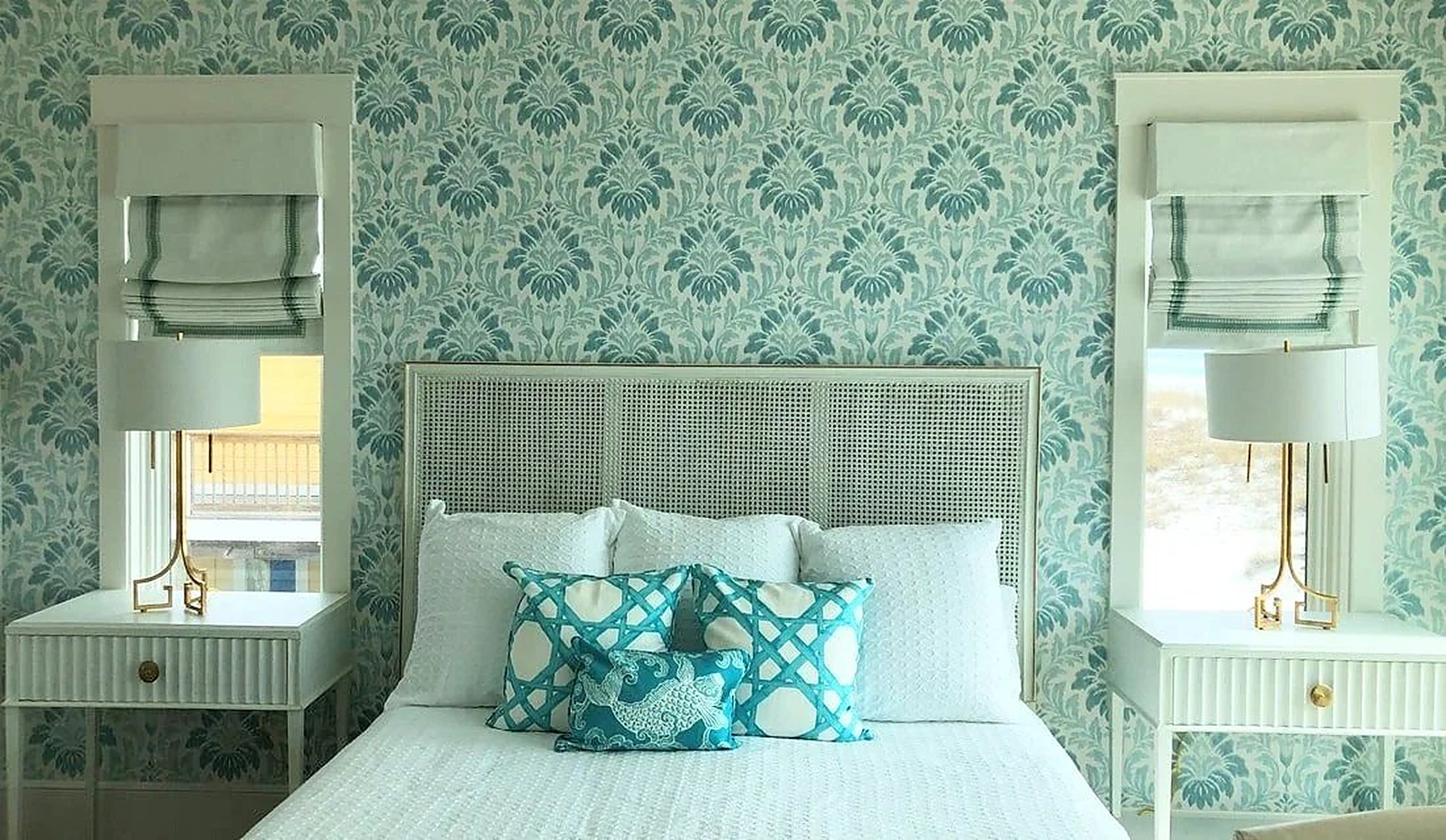 Bedroom with coordinated soft treatments and Roman shades
