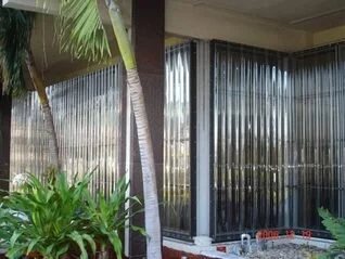 Clear polycarbonate storm panel installed over a window