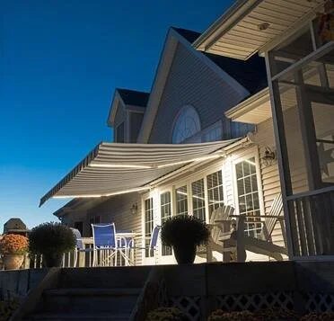 Retractable motorized awning over a deck