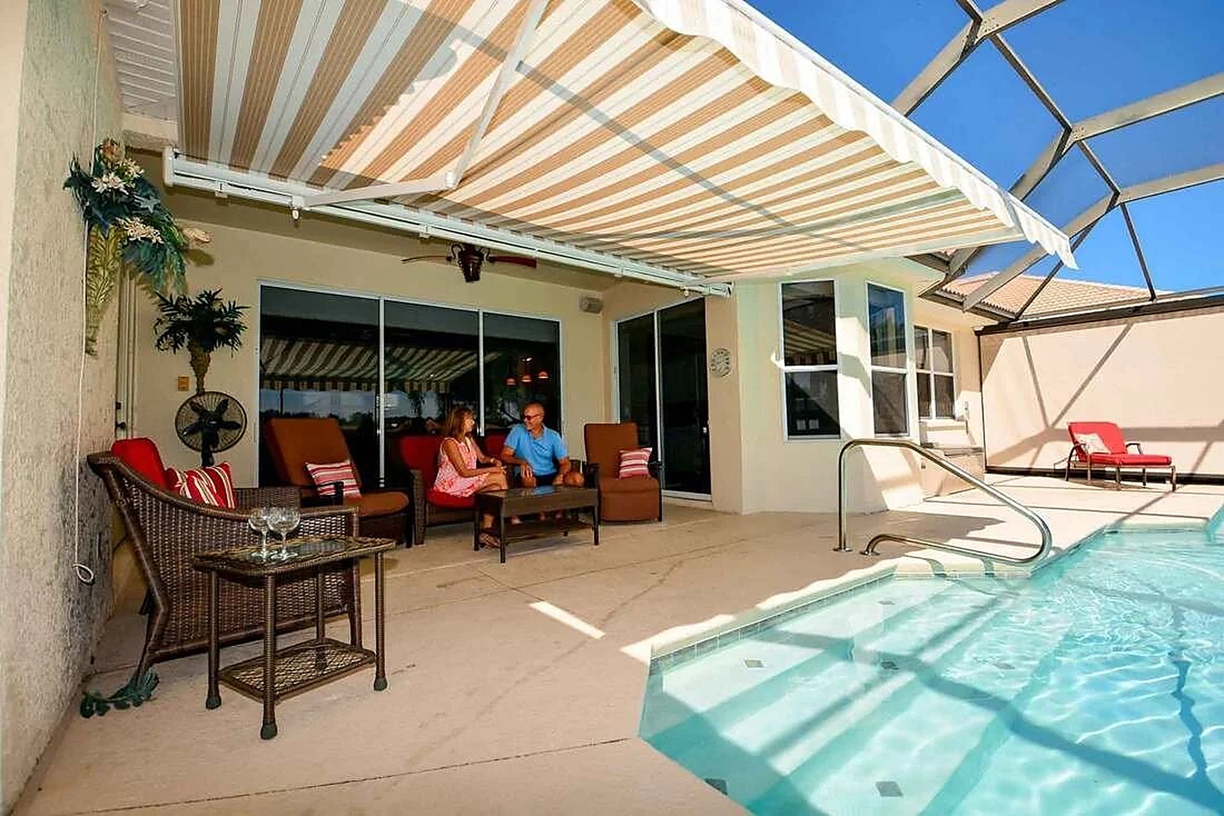 Awning extended over an outdoor patio seating area