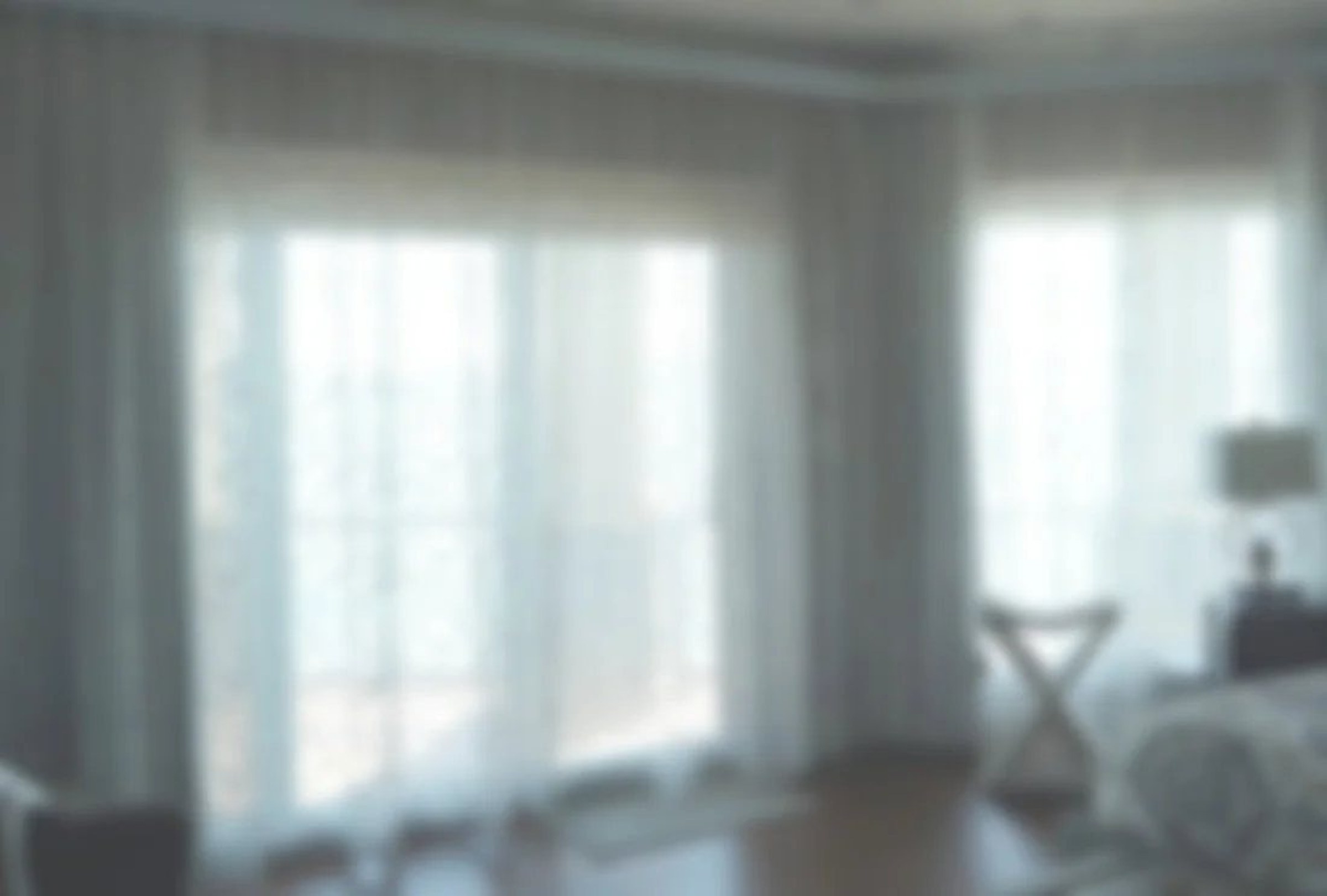 Custom drapery panels across a bedroom slider